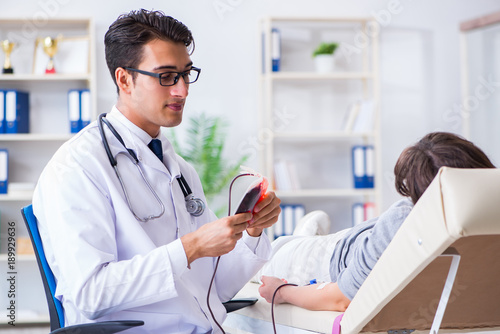 Patient getting blood transfusion in hospital clinic