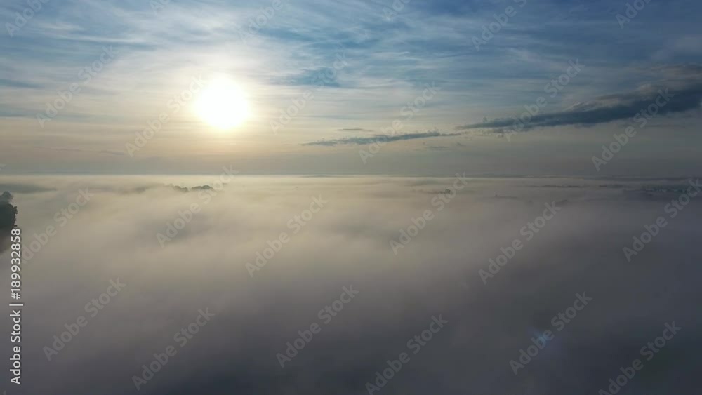 Flight from above over dense fog at dawn, 4k
Flight from above over dense fog at dawn, 4k