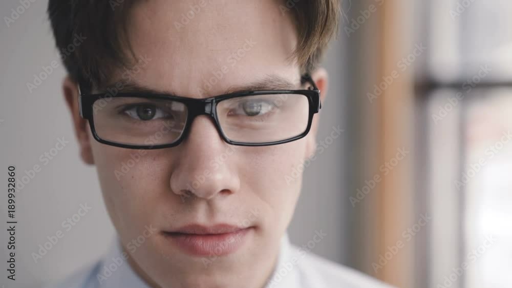 Close up look at camera of serious businessman. 4K Close up look at camera of serious businessman. 4K