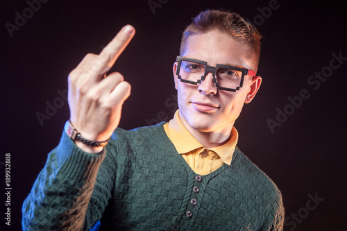 A man in glasses shows his ...