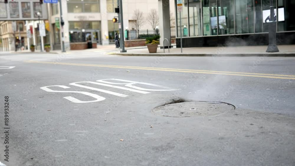 custom made wallpaper toronto digitalAtmosphere coming out of a Sewer Manhole Cover in urban area