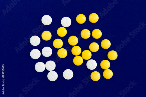 Obraz na płótnie Pills on blue background.