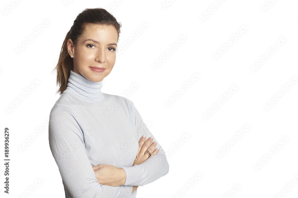 Confident mature woman. A smiling woman standing with arms crossed at isolated white background. Confident mature woman. A smiling woman standing with arms crossed at isolated white background.