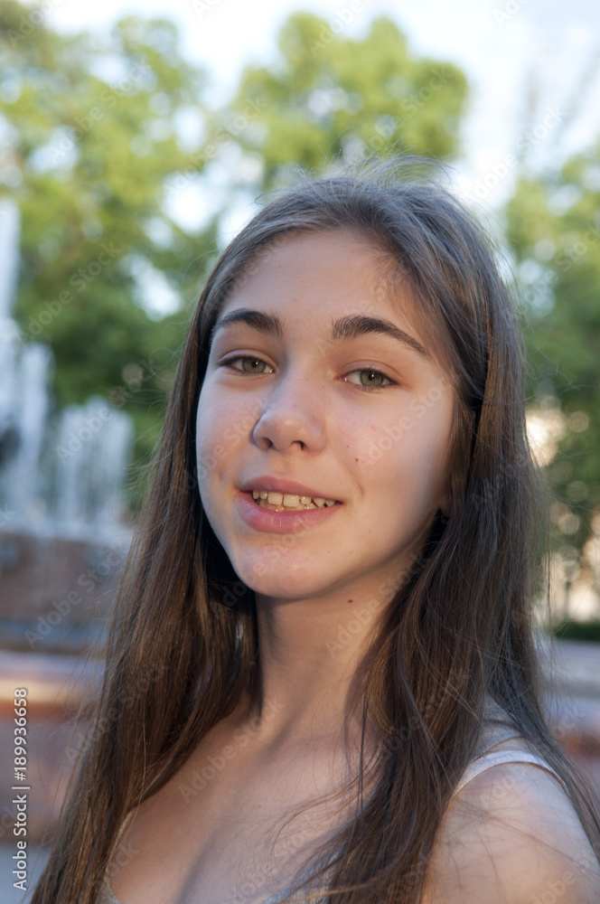 Closeup portrait of charming young female smiling Closeup portrait of charming young female smiling
