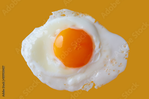 Fried Egg Close-up On Yellow Background