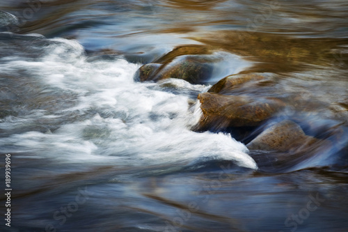 the early evening river with rapids