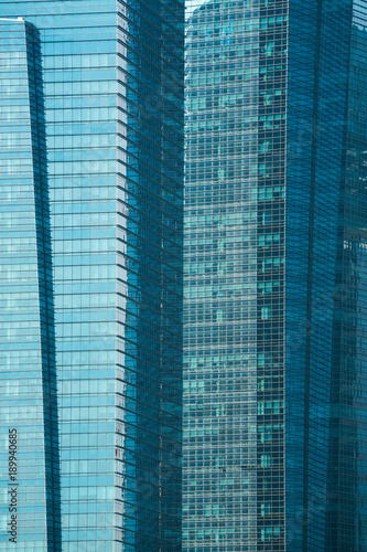 Glass facade of modern city high rise buildings