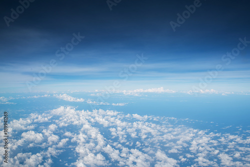 Sky background over spread cloud scatter, skyline separate zone between cloud and above blue © happystock
