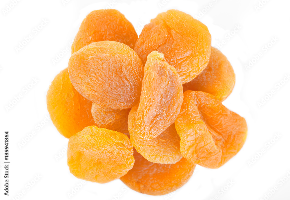 Dried apricot ingredient close up isolated on a white background. One orange apricot fruit with clipping path photo for advertising Dried apricot ingredient close up isolated on a white background. One orange apricot fruit with clipping path photo for advertising