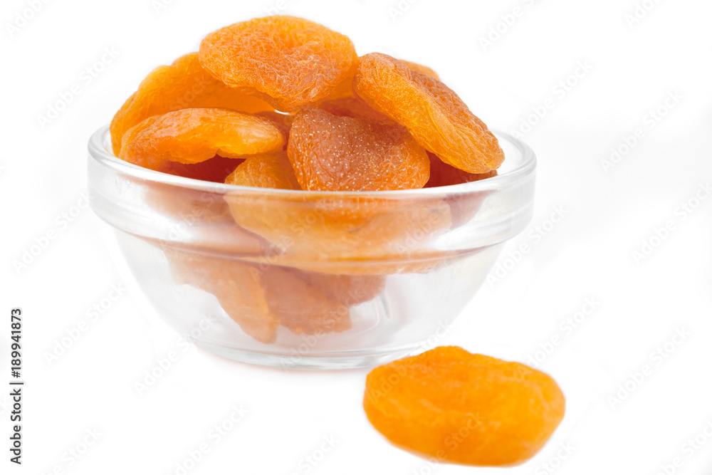 Dried apricot ingredient close up isolated on a white background. One orange apricot fruit with clipping path photo for advertising Dried apricot ingredient close up isolated on a white background. One orange apricot fruit with clipping path photo for advertising