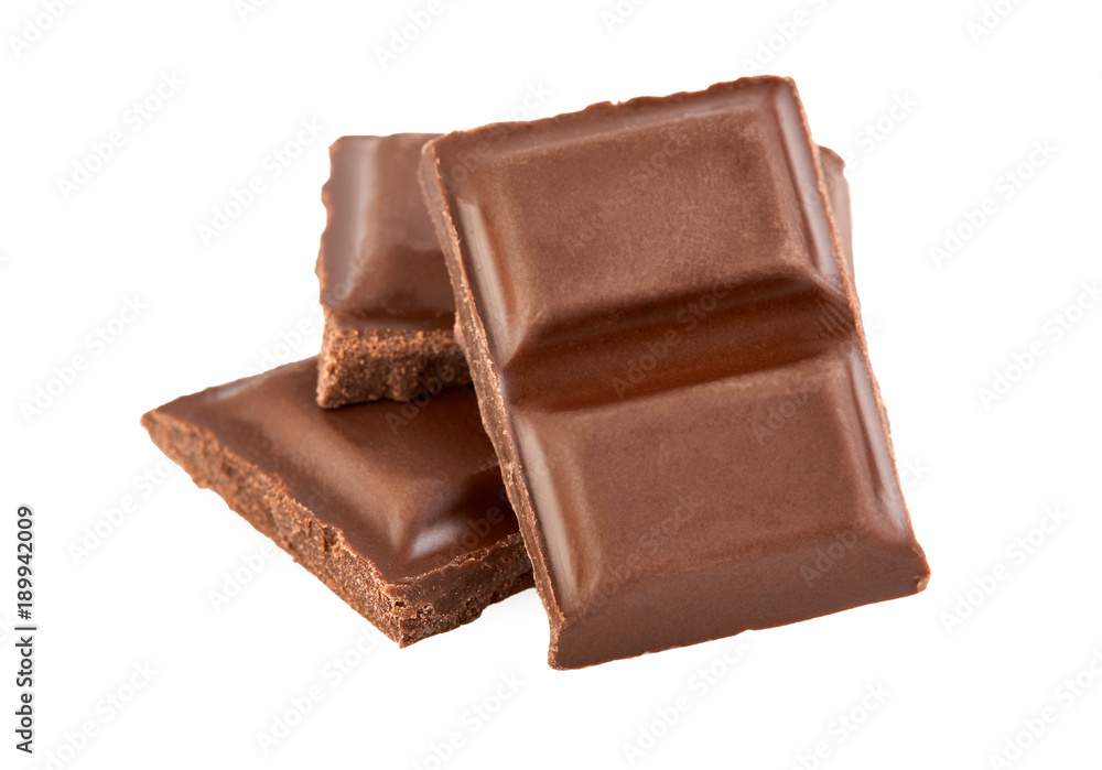 Milk chocolate pieces isolated on white background. Milk chocolate pieces isolated on white background.