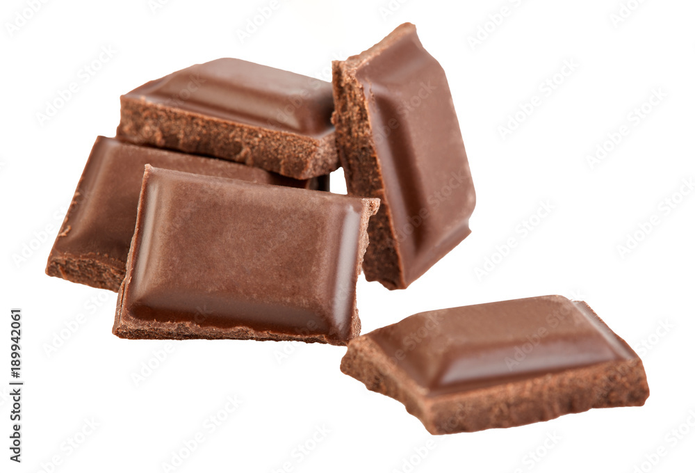 Milk chocolate pieces isolated on white background. Milk chocolate pieces isolated on white background.