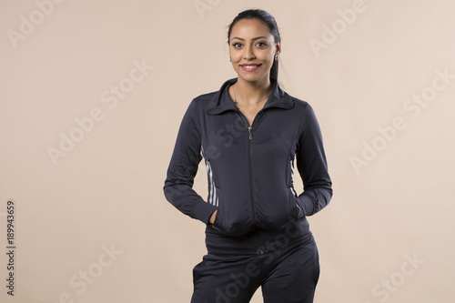 Fotografie charming beautiful young woman posing in sportswear smiling isolated