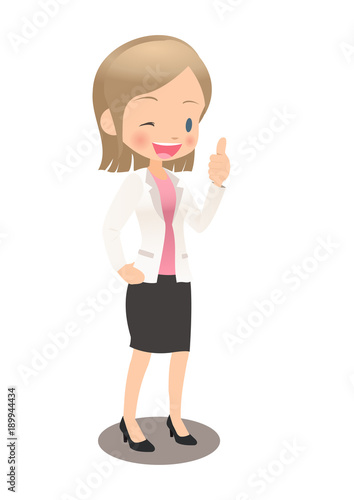 グッドサインを出すスーツ姿の若い女性会社員