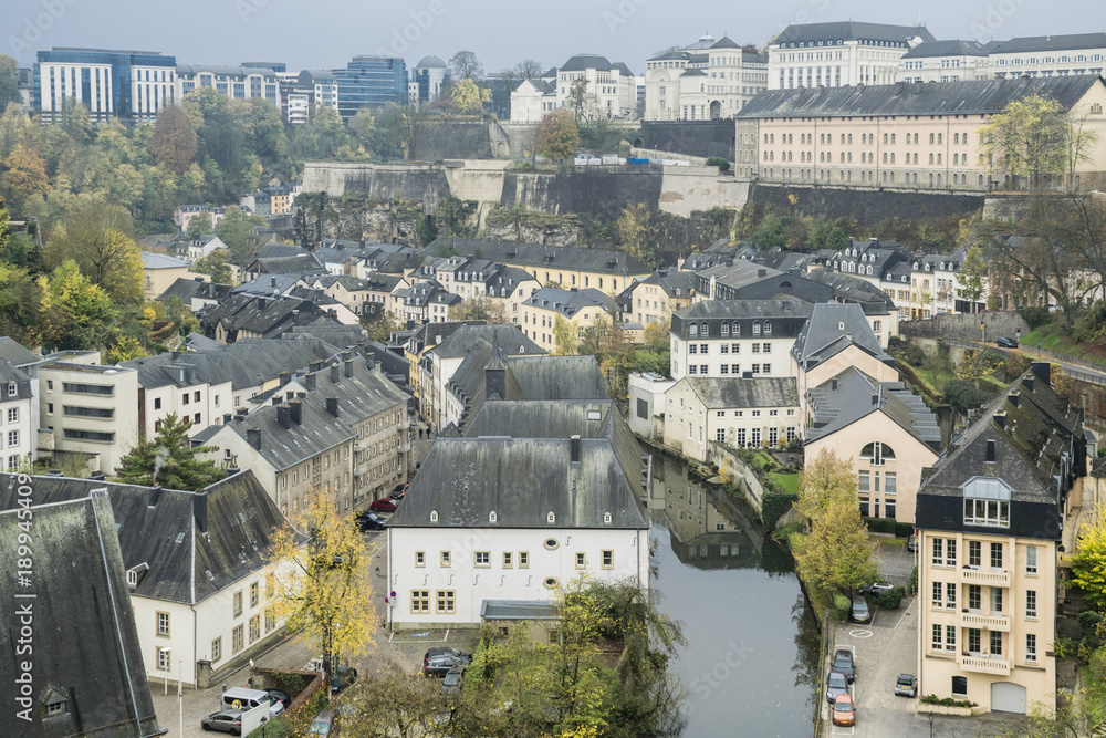 Luxembourg city details. Top view in downtown Luxembourg and details of traditional vintage houses in dark November day. Autumn urban landscape.