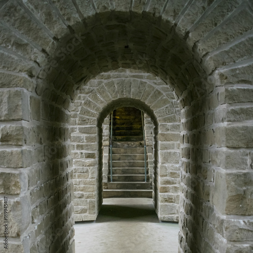Detail of medieval former fortifications of Luxembourg City with dark gloomy passage  arcs and stairs  Luxembourg.