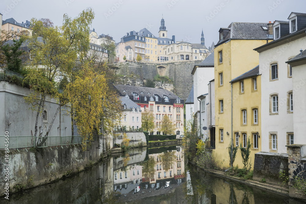 Detail of famous Luxembourg city line in November with Saint Michael Cathedral and water reflections, Luxembourg.