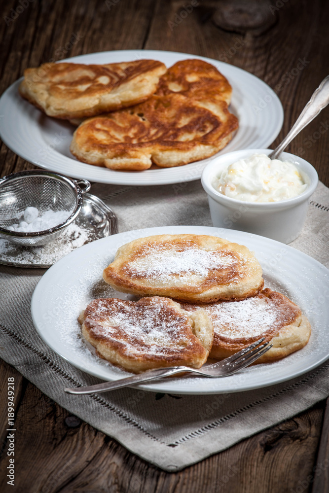 Polish pancakes with powdered sugar.