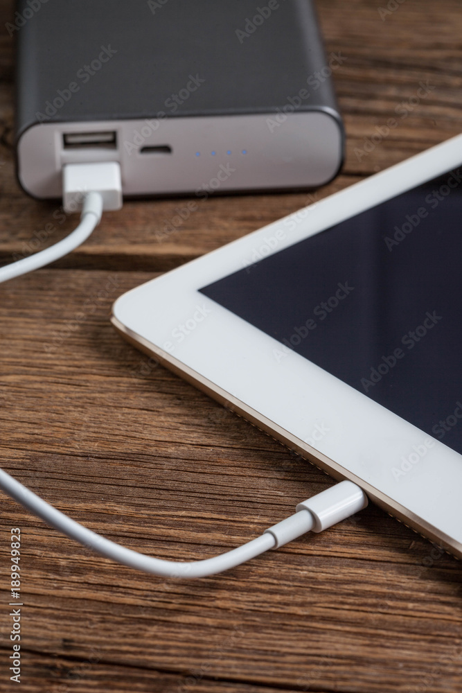 Smartphone charging with power bank. Smartphone charging with power bank.