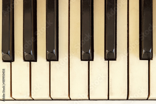Piano close-up, musical instrument. learn to play the instrument at home. white large piano. piano keyboard. concert concept. photo