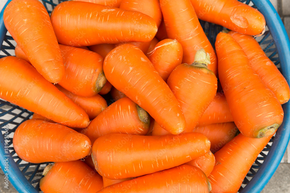 Pile of fresh carrots at for display at market Pile of fresh carrots at for display at market