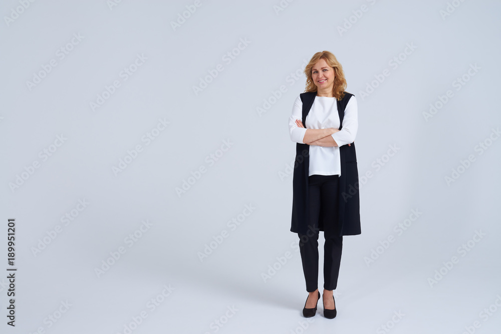 Full length photo of smiley mature blond Full length photo of smiley mature blond