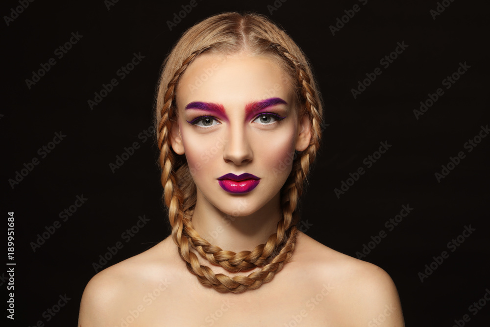 Young woman with dyed eyebrows on black background Young woman with dyed eyebrows on black background