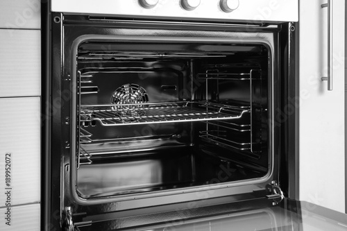 Empty electric oven in kitchen, closeup photo