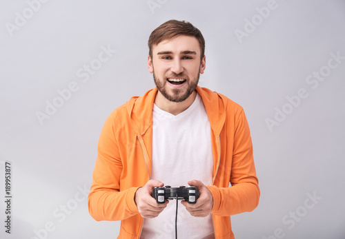 Happy man with video game c...