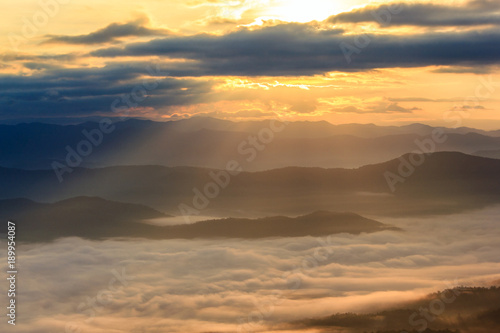 Sunbeam in the mountains and mist at at Doi Samer Dao, Nan Province, Thailand © Southtownboy Studio
