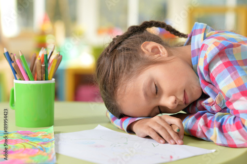girl sleeping after drawing