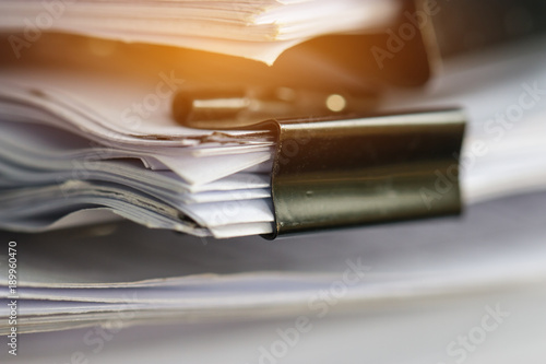 Stack of Paper documents with clip, Pile of unfinished documents on office desk folders. Business papers for Annual Report files, Document is written,presented. Business offices concept.