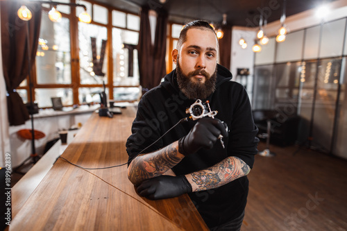 Portrait of professional creative tattoo master