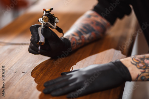 Portrait of professional creative tattoo master