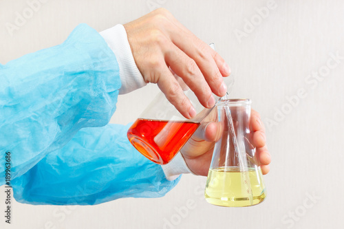 Laboratory assistant hands doing chemical experiments in the laboratory