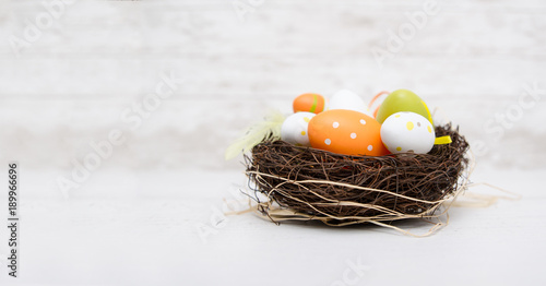Happy easter decoration. Eggs in the nest.
