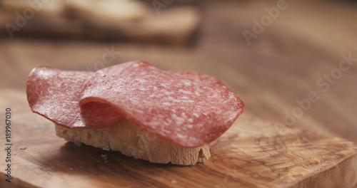 baguette slice with cream cheese and salami
