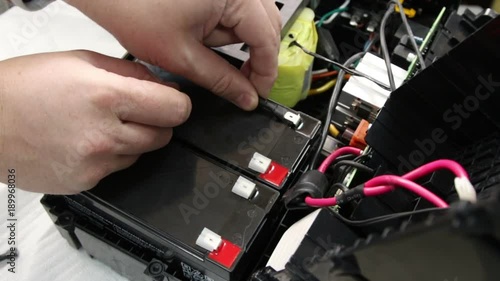 Connection of electric cables to uninterruptible Power Supply Battery.