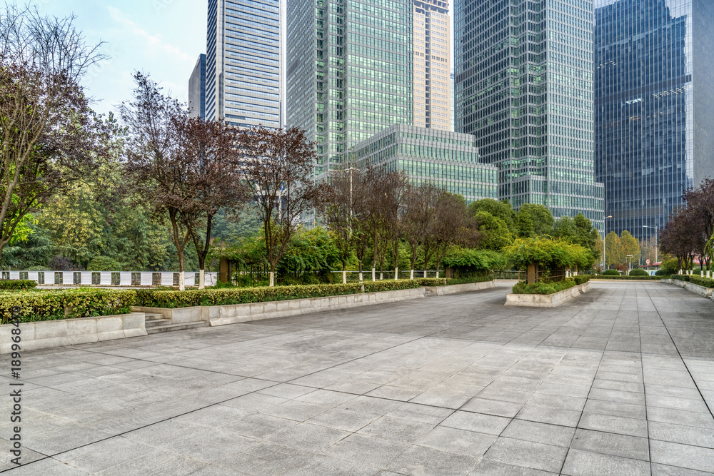Panoramic skyline and buildings with empty concrete square floor Panoramic skyline and buildings with empty concrete square floor