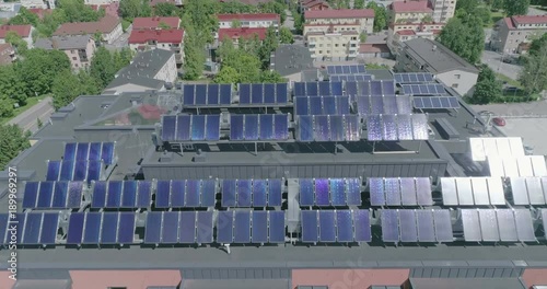 Midday Aerial View Of Apartment House with solar panels on roof in residential are of Lahti, Finland, Forward movement