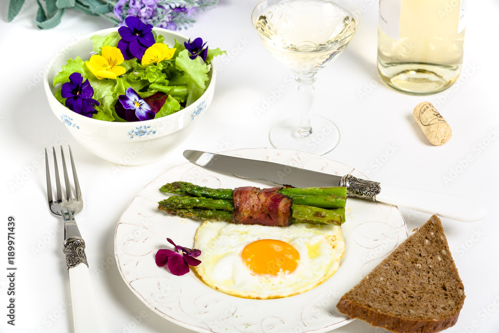 Egg with asparagus and bacon on a Mediterranean style Egg with asparagus and bacon on a Mediterranean style