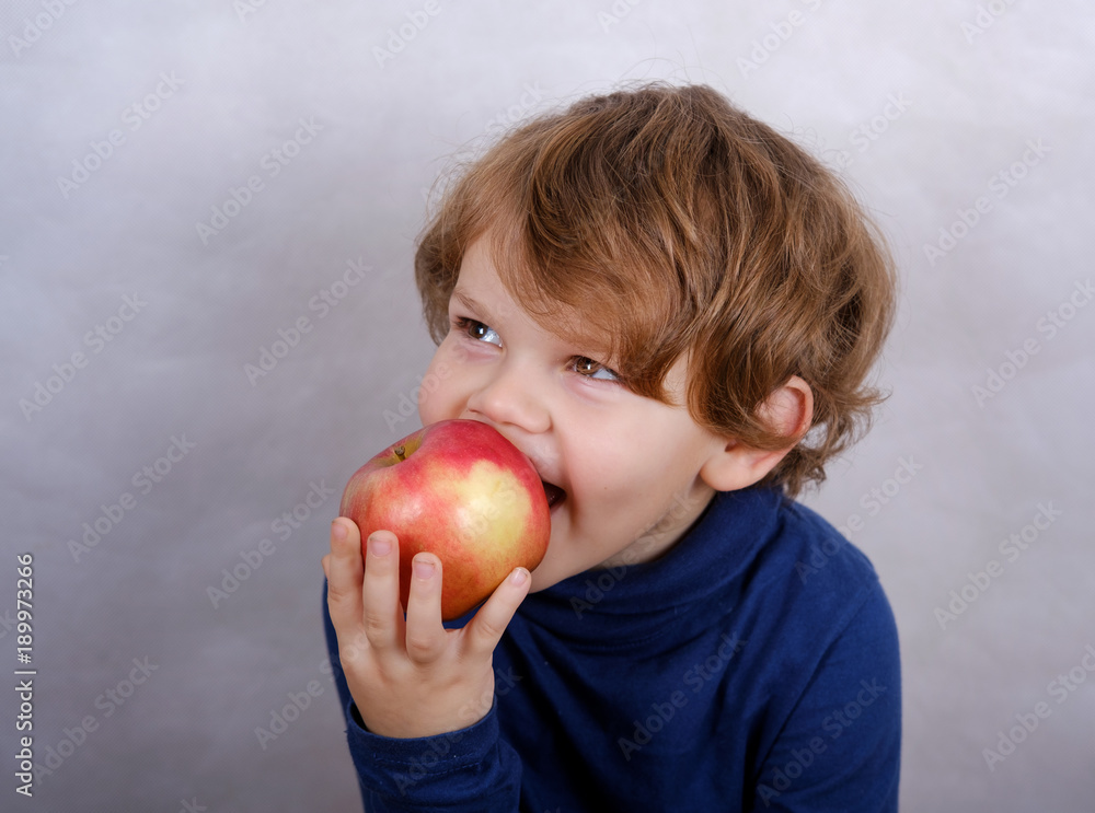 boy eating red Apple boy eating red Apple