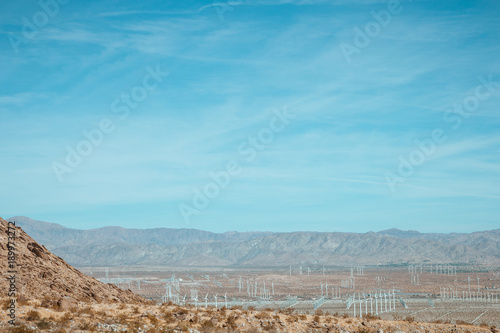 Wind generator farm against the blue sky and beautiful landscape