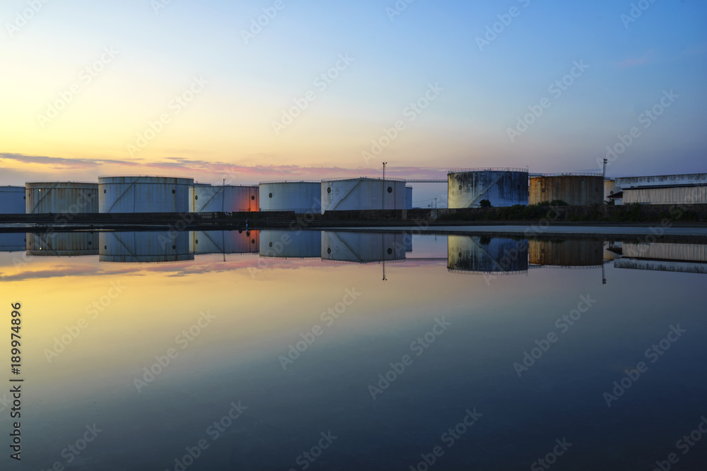 White oil tank, water reflection, beautiful evening