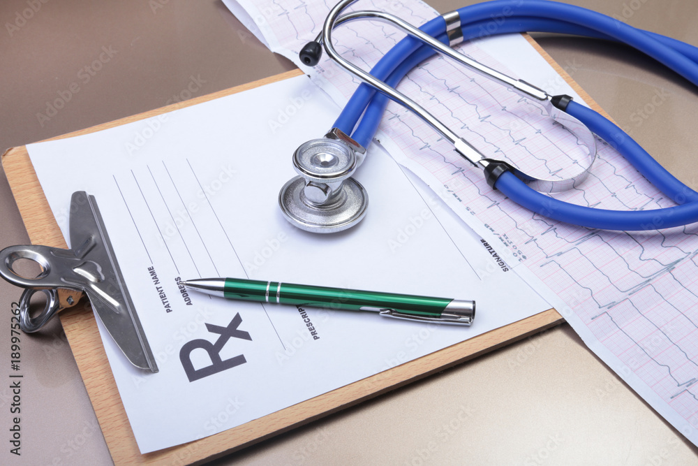 RX prescription, stethoscope, Red heart and pils on white background RX prescription, stethoscope, Red heart and pils on white background