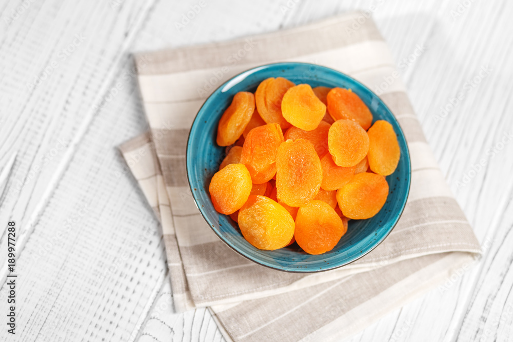 Useful dried apricots in the plate. Copy Space. The concept is healthy food, diet, vegetarianism.