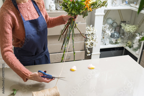Floristry courses. Learn to master the art of ikebana. Florist shares her skills showing how to arrange flowers in a perfect beautiful bouquet