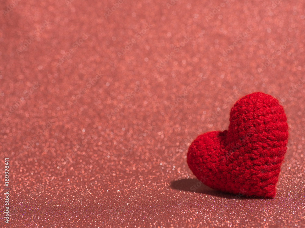 Red yarn heart on the red floor and background copy space for text. Valentines day, love concept and love background Red yarn heart on the red floor and background copy space for text. Valentines day, love concept and love background