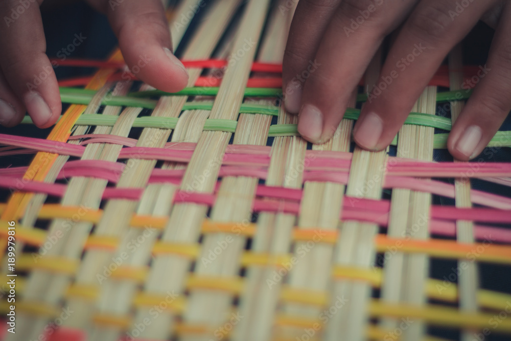 Fototapeta premium Closeup to hand of Thai students grade 4 in primary school are weaving pattern thai.