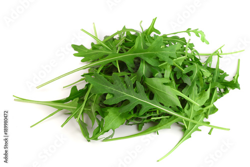Heap of Green fresh rucola or arugula leaf isolated on white background photo